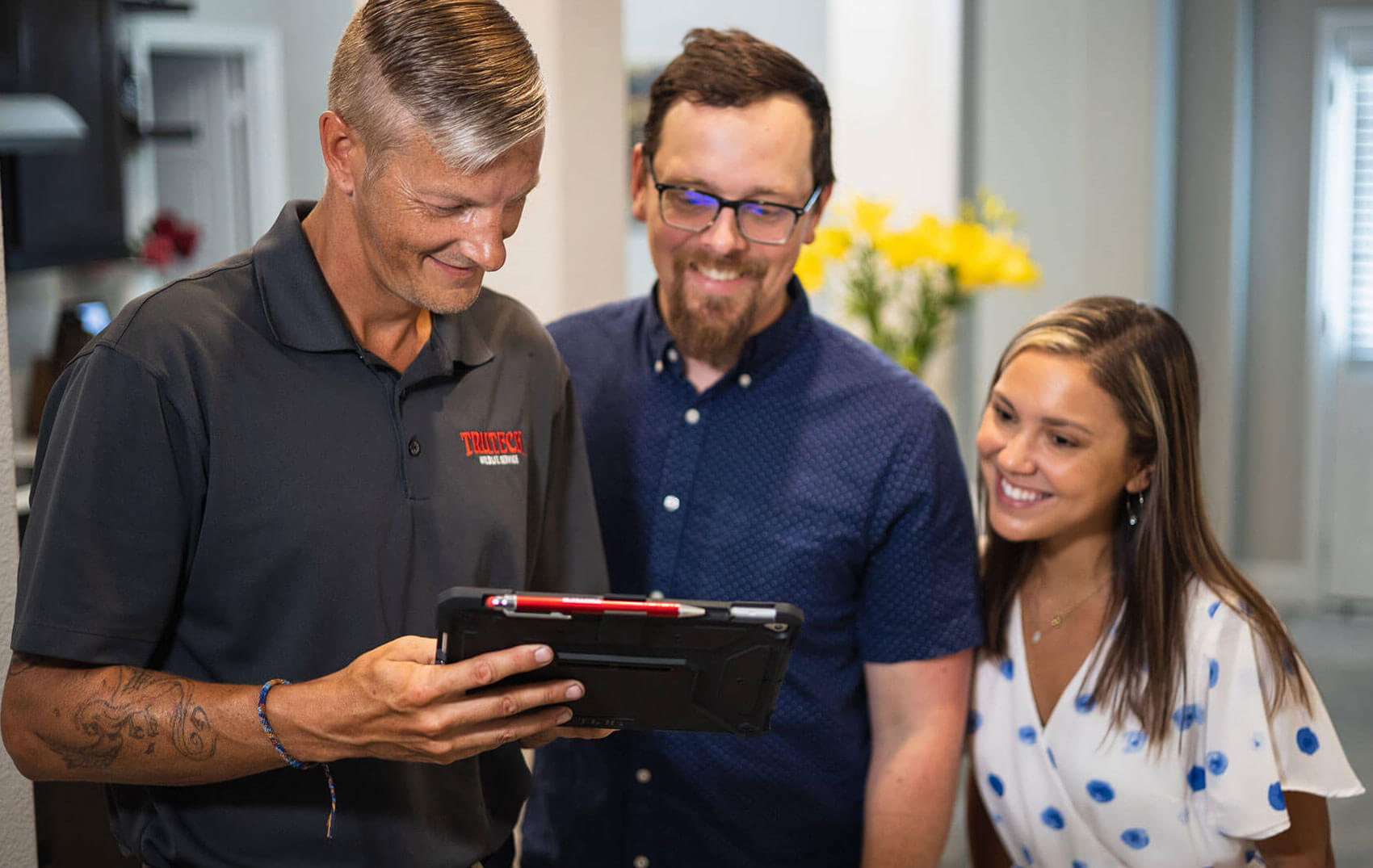 Trutech technician reviewing assessment with customers