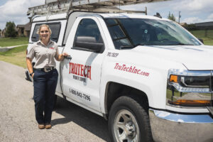 Trutech technician standing near truck