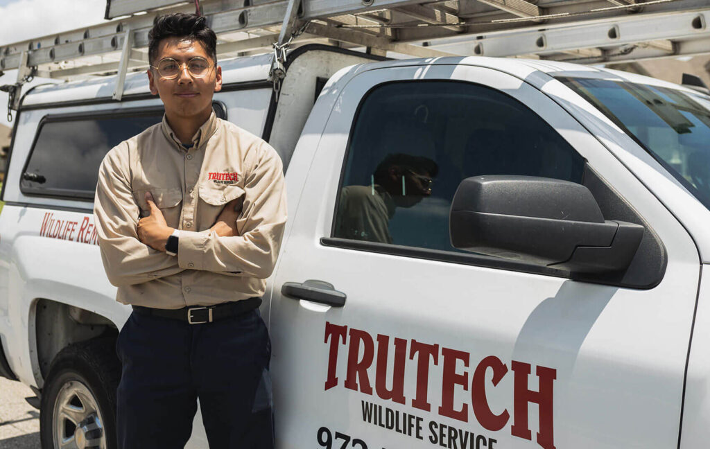 Trutech technician standing near truck