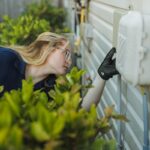 Trutech technician inspecting the exterior walls of a home