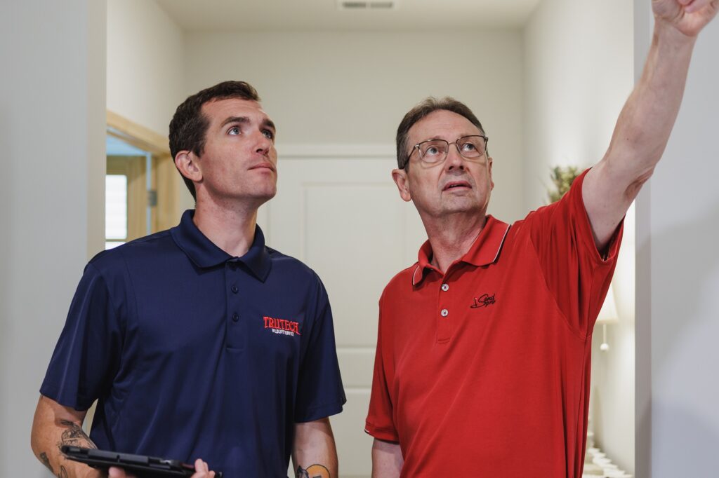 Trutech technician serving a customer in their home
