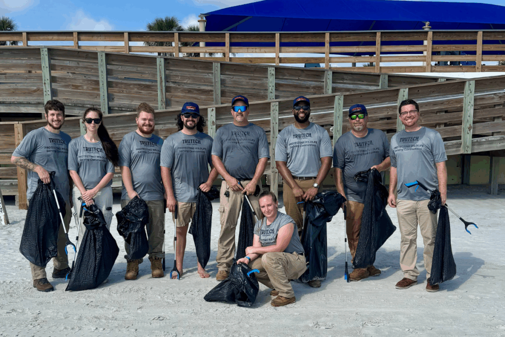 Trutech teammates posing for a photo after cleaning up an Orlando beach